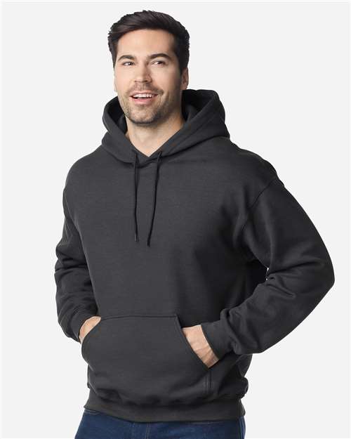 Gildan Unisex Heavy Blend hoodie with front kangaroo pocket, drawstring hood, and ribbed cuffs in a casual fit.