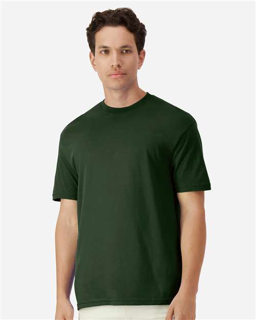 Gildan 100 plain T-shirts in assorted colors, stacked in a pile, available in a limited-time deal for bulk purchase.