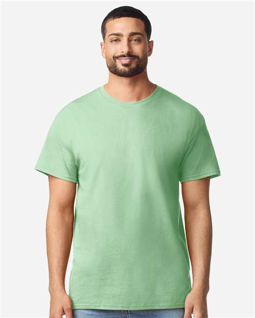 Gildan 100 plain white T-shirts displayed in a bundle, showcasing versatile casual wear for men and women.