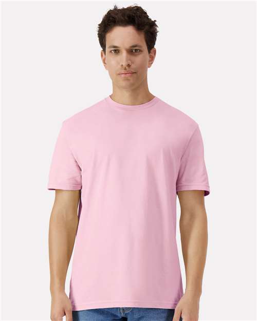 Gildan 100 white T-shirts stacked in a box, promotional image for a limited-time deal on bulk T-shirt purchase.