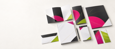 Brochures, letterhead, envelopes, and stationery arranged for professional presentation
