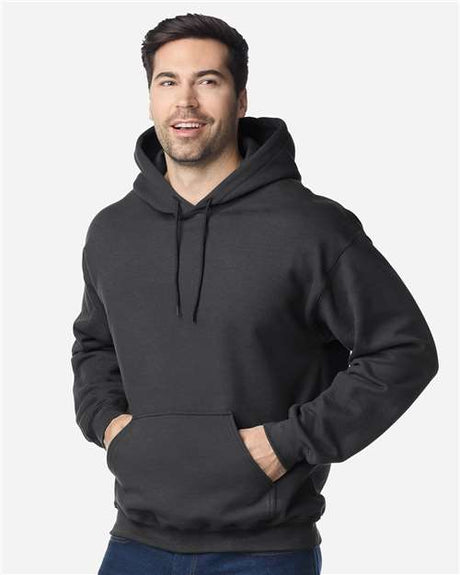 Gildan Unisex Heavy Blend hoodie with front kangaroo pocket, drawstring hood, and ribbed cuffs in a casual fit.
