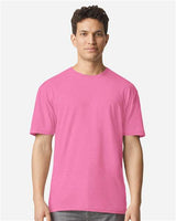 Gildan 100 white T-shirts stacked, showcasing a bulk pack of plain cotton shirts for casual wear or printing.