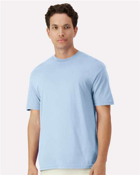 Assorted Gildan T-shirts in various colors, stacked neatly for display, highlighting the quality and variety of the product.