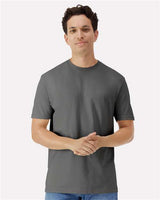 Gildan 100 white T-shirts stacked in a pile, showcasing the casual cotton shirt style.