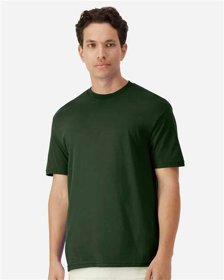 Gildan 100 plain T-shirts in assorted colors, stacked in a pile, available in a limited-time deal for bulk purchase.
