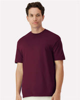Gildan 100 plain T-shirts in various colors, folded and stacked, available in a bulk deal for wholesale purchase.