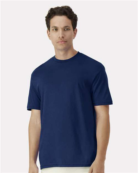 Gildan 100 white T-shirts laid out flat, showcasing soft cotton fabric and classic crew neck design.