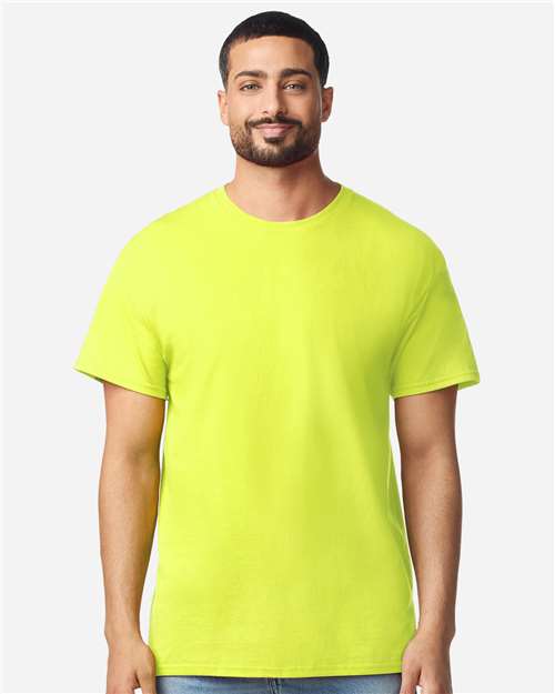 Gildan 100 plain T-shirts in various colors, displayed in a pile, available in a limited-time deal for bulk purchase.