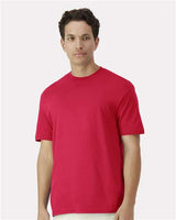Gildan 100 white T-shirts displayed in a bundle, showing a variety of plain cotton shirts for a bulk clothing deal.