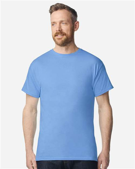 Gildan 100 white T-shirts stacked together, showcasing soft cotton fabric and classic crew neck design.
