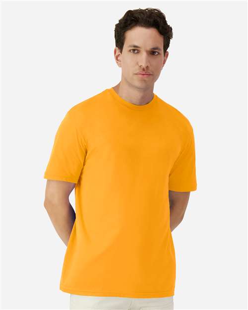 Gildan 100 white T-shirts stacked in a pile, showcasing a bulk deal offer for affordable wholesale shirts.