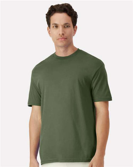 Gildan 100 white T-shirts stacked in a box, available in a limited-time deal for bulk purchase.