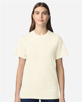 Gildan 100 plain T-shirts in various colors, folded and stacked, on a display shelf.