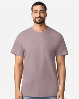 Gildan 100 plain white T-shirts laid flat, showcasing soft cotton fabric and classic crew neck design.