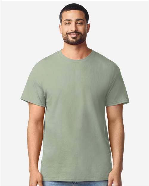 Gildan 100 white T-shirts laid flat, showing plain cotton shirts perfect for casual wear or bulk purchase.