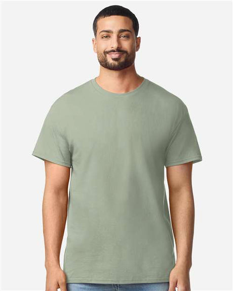 Gildan 100 white T-shirts laid flat, showing plain cotton shirts perfect for casual wear or bulk purchase.