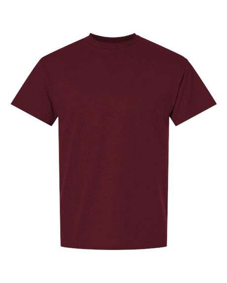 Gildan brand 100 white T-shirts stacked neatly, showing front view and soft cotton fabric for bulk clothing order.