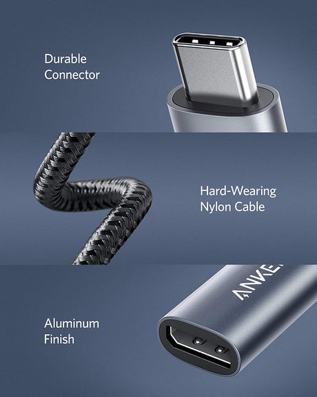 Anker PowerExpand USB-C to DisplayPort adapter connected to a laptop, showing the sleek black connector and cable.