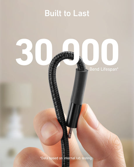 Anker 551 USB-A to Lightning charging cable in black, 6 feet long, shown coiled and ready for device charging.