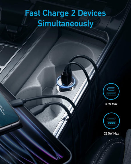 Anker 323 car charger with 52.5W power output, shown plugged into a vehicle's cigarette lighter socket with charging ports visible.