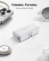 Anker Nano 12W power bank with built-in Lightning connector for portable charging, shown in a sleek compact design.