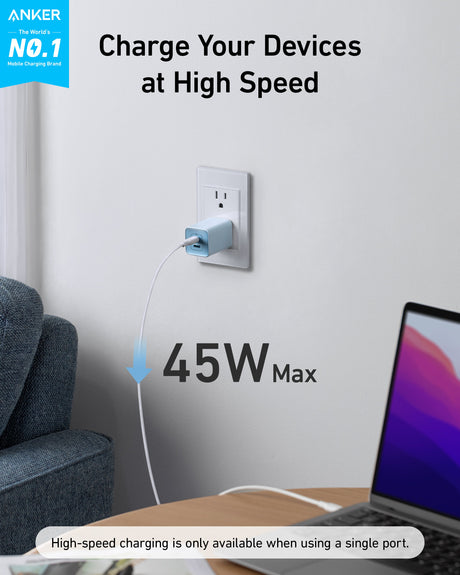 Anker 523 Nano 3 47W charger with compact design, shown plugged into a wall outlet with charging cable attached.