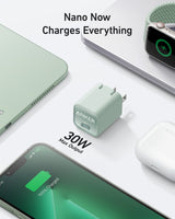 Anker Nano 30W charger for fast charging devices, sleek compact design, shown plugged into a power outlet.