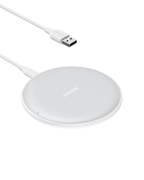 Anker 313 wireless charging pad for fast, cable-free charging of compatible smartphones on a sleek, minimalist surface.