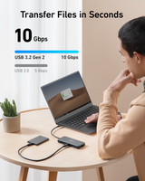 Anker 555 USB-C 8-in-1 hub with multiple ports for charging and connectivity, shown in a sleek black design.