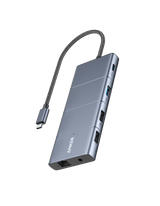 Anker 565 USB-C Hub charging only with multiple ports, compact design, and sleek black finish, shown connected to a laptop.