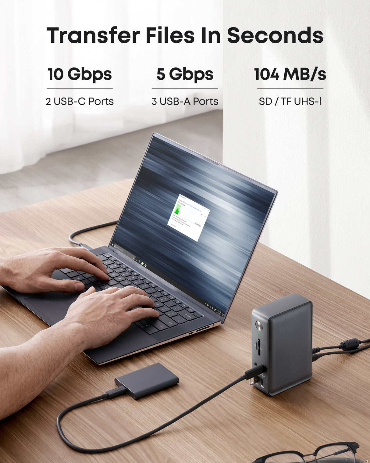 Anker 575 USB-C Docking Station 13-in-1 charging dock with multiple ports shown on a sleek surface.