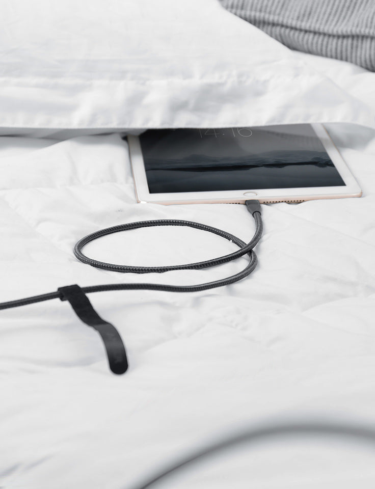 Anker 551 USB-A to Lightning charging cable in 3, 6, or 10 feet length, shown connected to a device for charging.