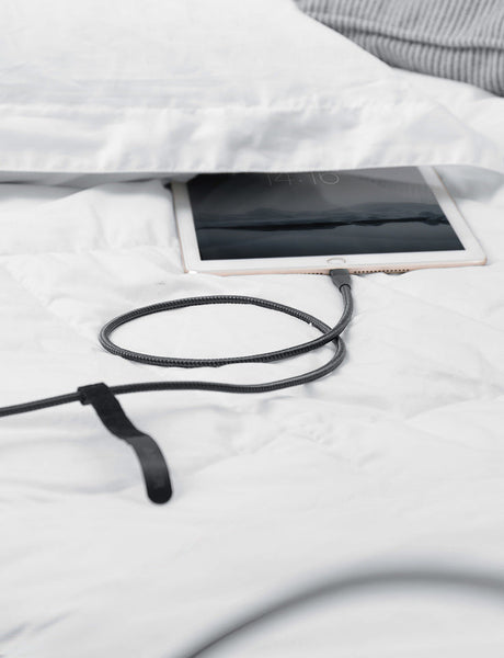 Anker 551 USB-A to Lightning charging cable in 3, 6, or 10 feet length, shown connected to a device for charging.