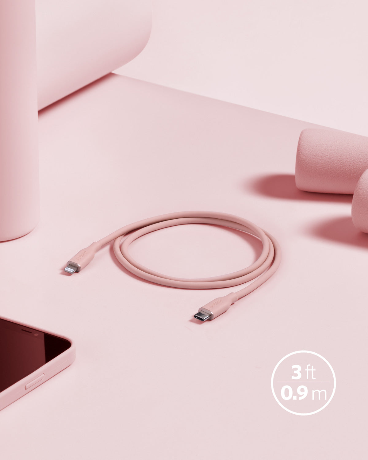 Anker 641 USB-C to Lightning Cable, 3 ft silicone cable with Flow design, shown coiled and connected to devices.