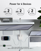 Anker Nano 6-in-1 67W charging station with multiple ports for fast charging devices, shown on a clean surface.