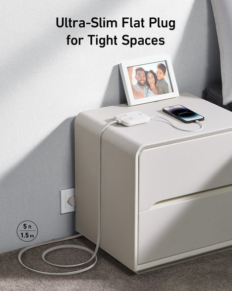 Anker Nano 6-in-1 67W charging station with multiple ports for fast charging of various devices, sleek black design.