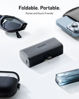 Black Anker Nano Power Bank with 12W charging and built-in Lightning connector for portable device charging.