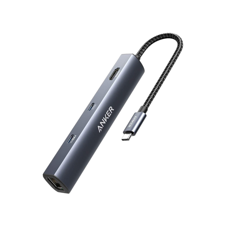 Anker 543 USB-C Hub 6-in-1 slim charging hub with multiple ports, shown in a modern workspace setup.