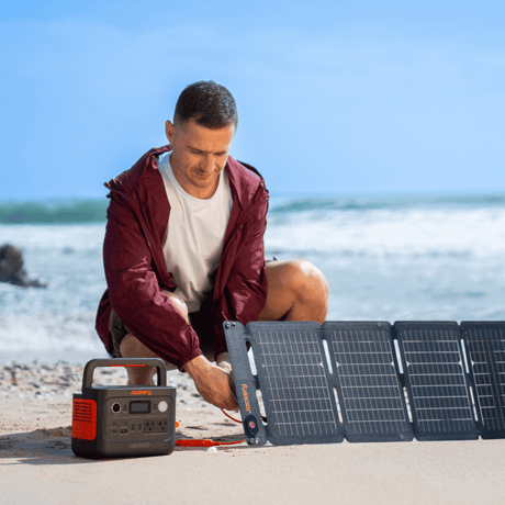 Jackery Explorer 300 V2 portable power station with solar generator, compact design, and multiple charging ports.