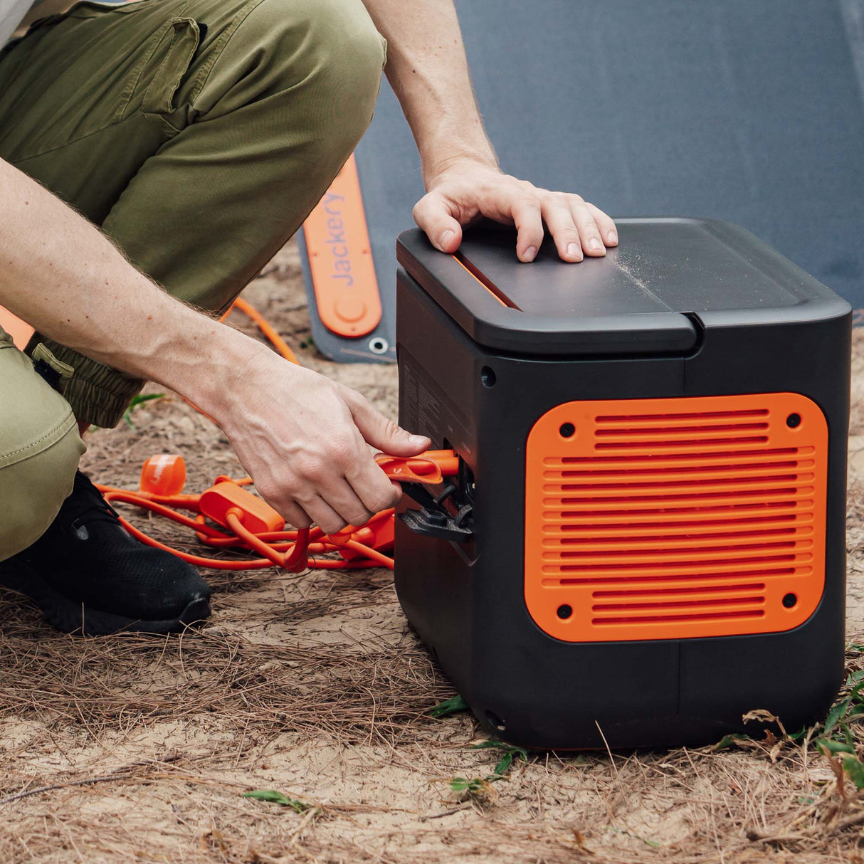 Jackery Solar Panel Connector for handbags, showing a compact, durable black connector with cable attachment for solar charger compatibility.
