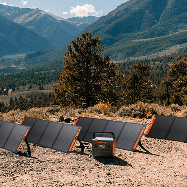 Jackery SolarSaga 200W solar panel outdoors, folded with visible solar cells and sturdy handle for portable solar power.